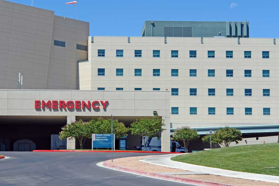 Exterior of hospital building showing Emergency Room in foreground
