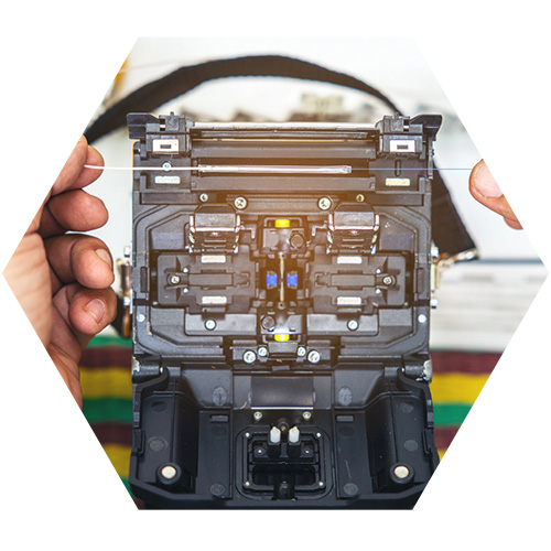 person configuring fiber optics cables