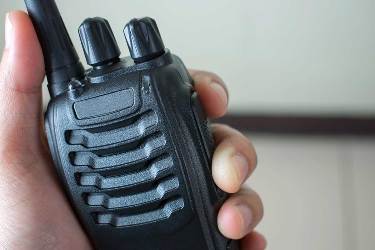 Two Way Radio being held up in hand