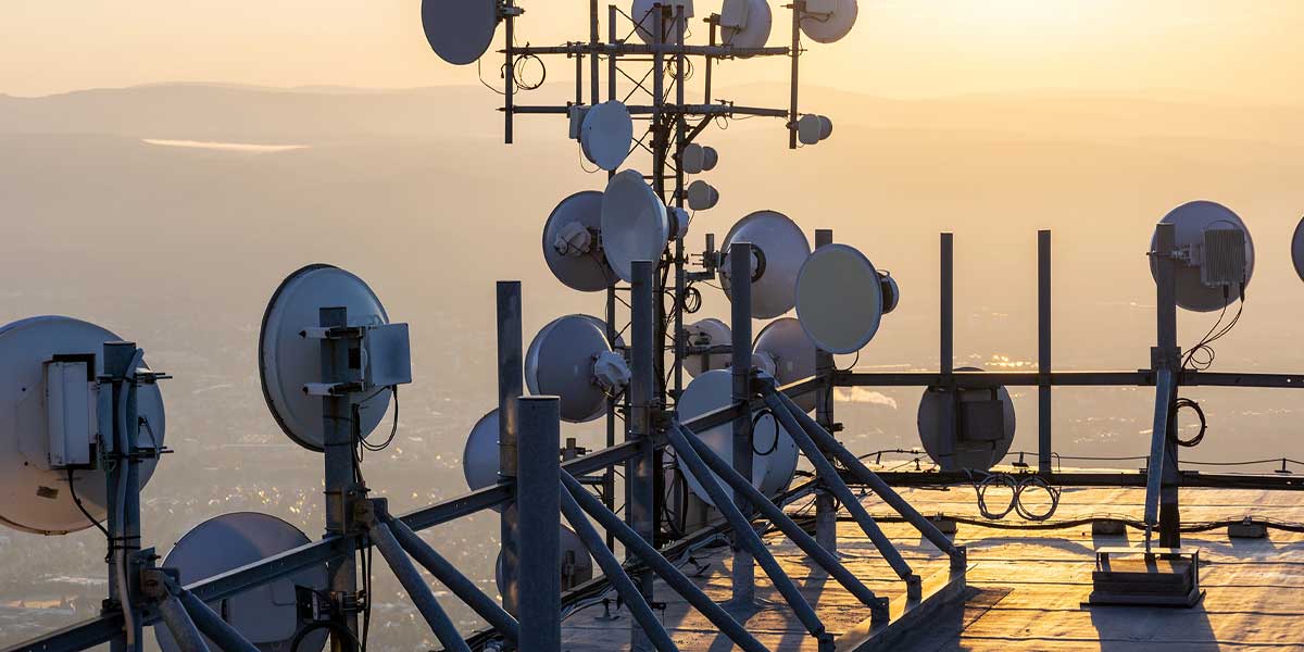 Wireless antennas on top of a building overlooking land