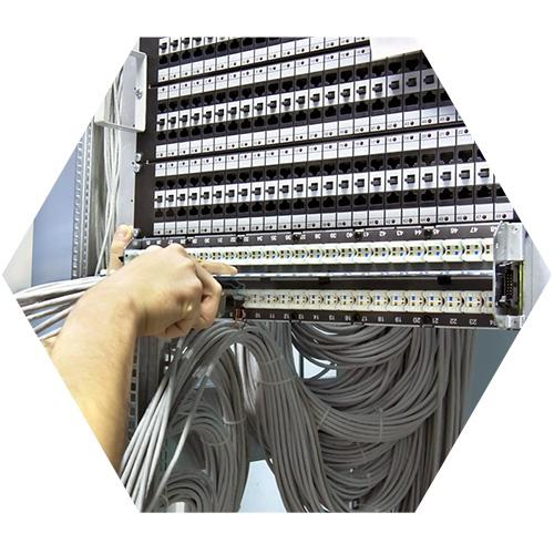 person at a network cabling station setting up network connections